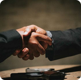 Business partnership handshake
